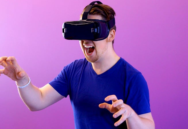 A man playing with a VR headset